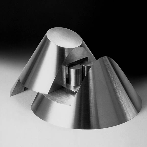 Machined aluminium cone opening on a dovetail joint revealing two silver storage cylinders