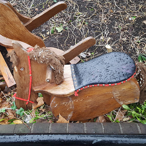 Broken wooden rocking horse