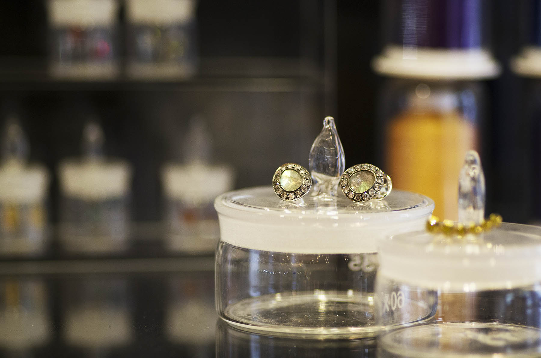 Annoushka Milestones Exhibition display cabinet - Dusty Diamond rings sitting on top of glass pots