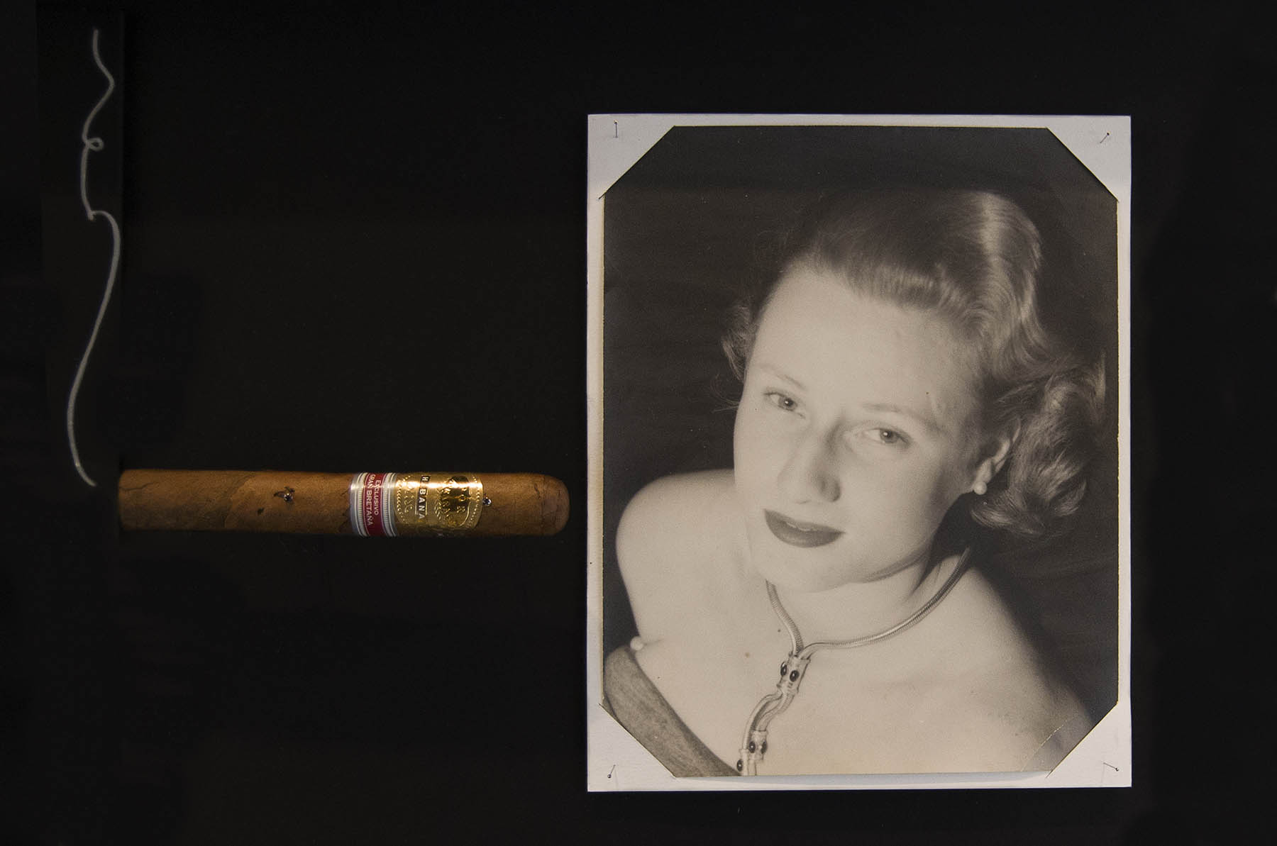 Annoushka Milestones Exhibition display cabinet - Photo of Annoushka's Mother with large cigar and puff of smoke