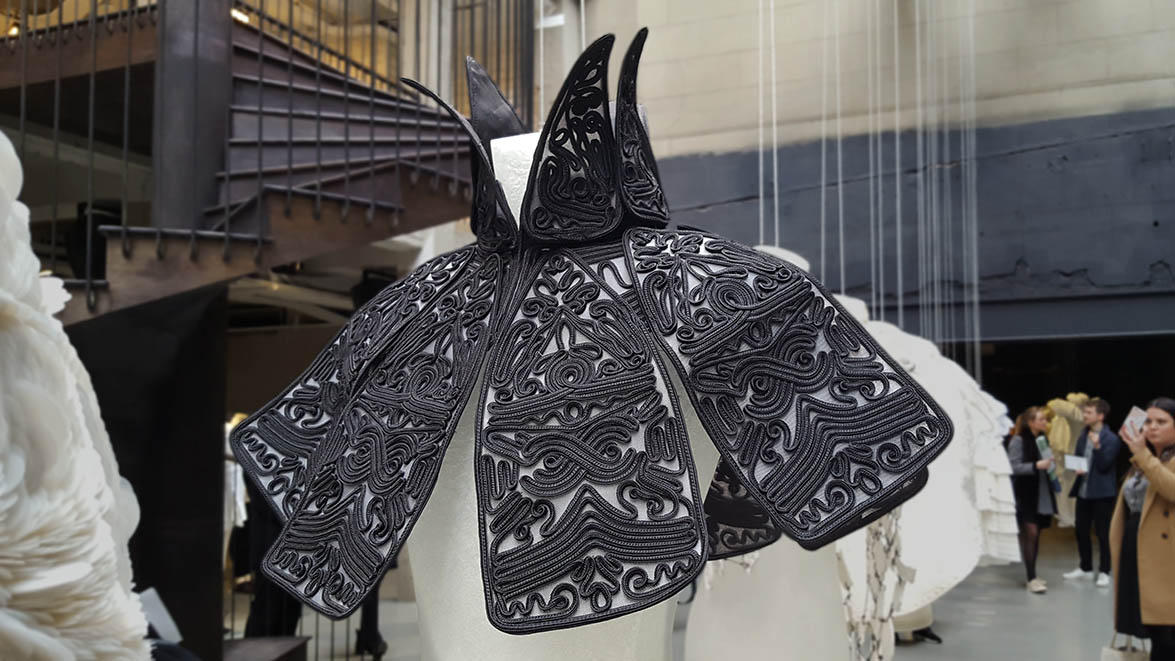 Burberry cape made from openwork black swirls 