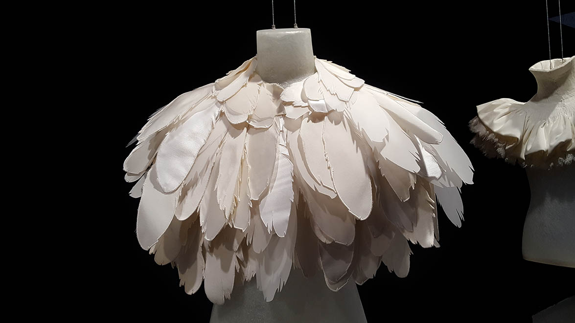 Burberry cape made from large white flat feathers