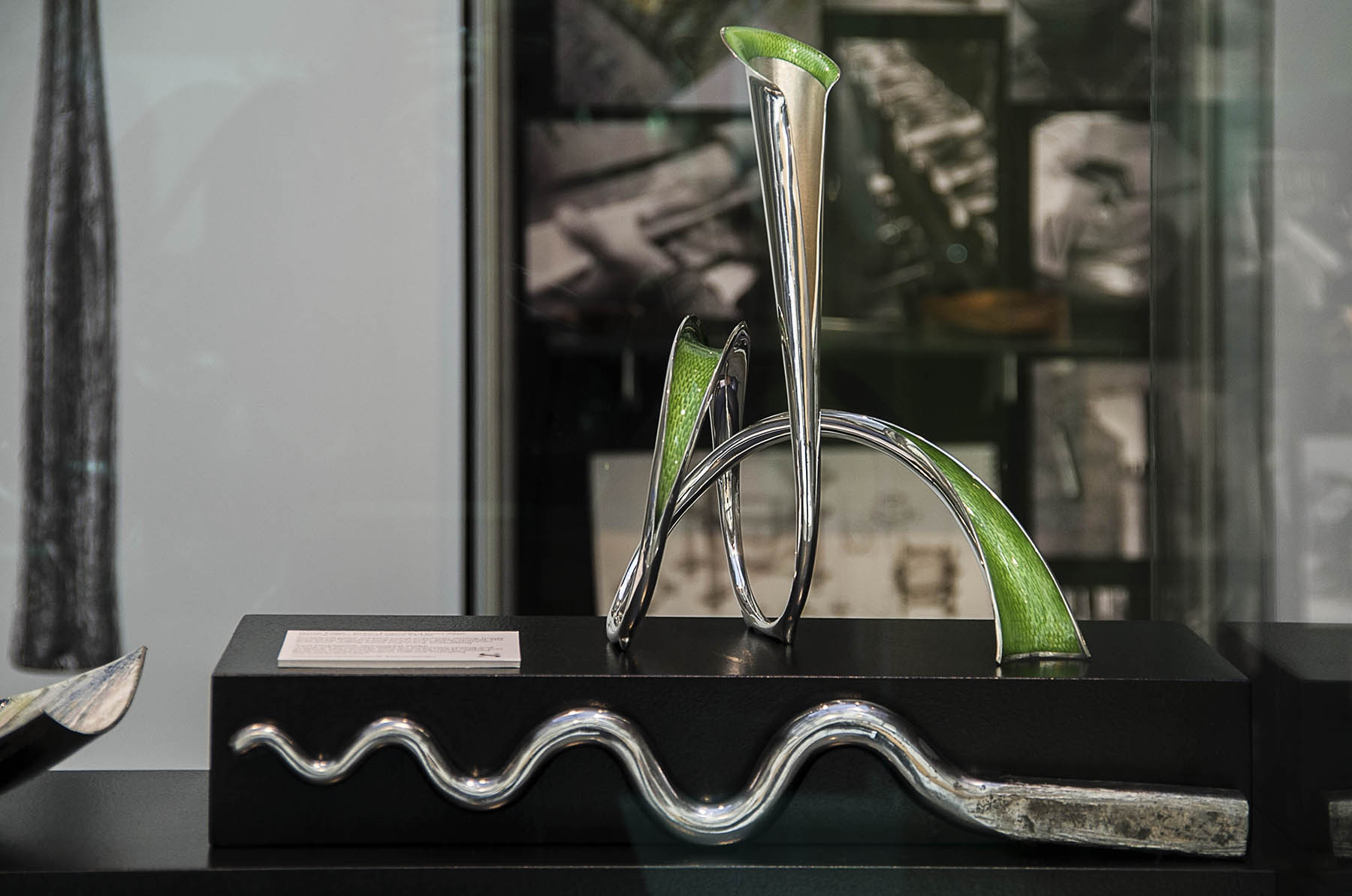 Silver Speaks Form Exhibition display case - Jenny Edge green enamel knot vase with sinusoidal stake