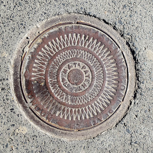 Manhole Cover, London - Cast iron Zig Zag pattern inscribed with M&T PATENT