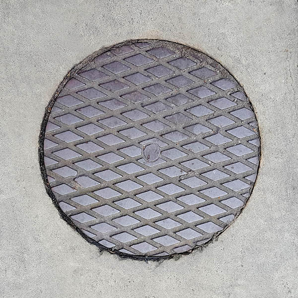Manhole Cover, London - Cast iron with criss cross lines