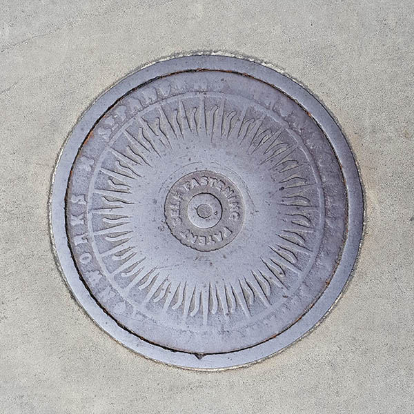 Manhole Cover, London - Cast iron sunburst