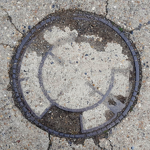 Manhole Cover, London - Cast iron and concrete
