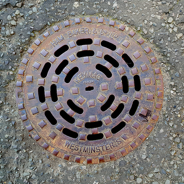 Manhole cover, London - Cast iron circular openwork grid pattern