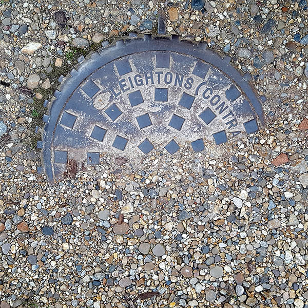 Manhole cover, London - Cast iron raised grid pattern