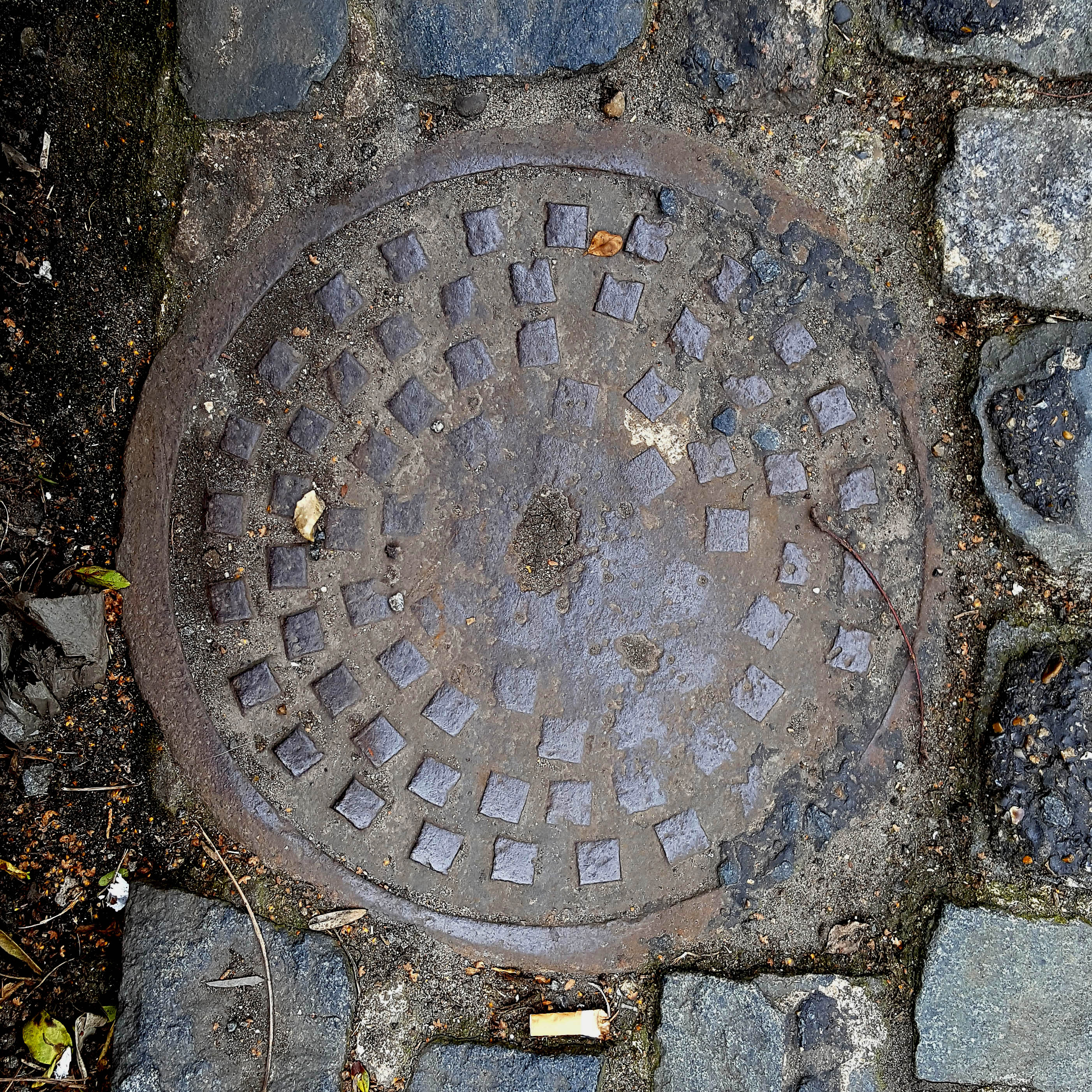 Manhole Cover, London - Cast iron with pattern of small raised squares