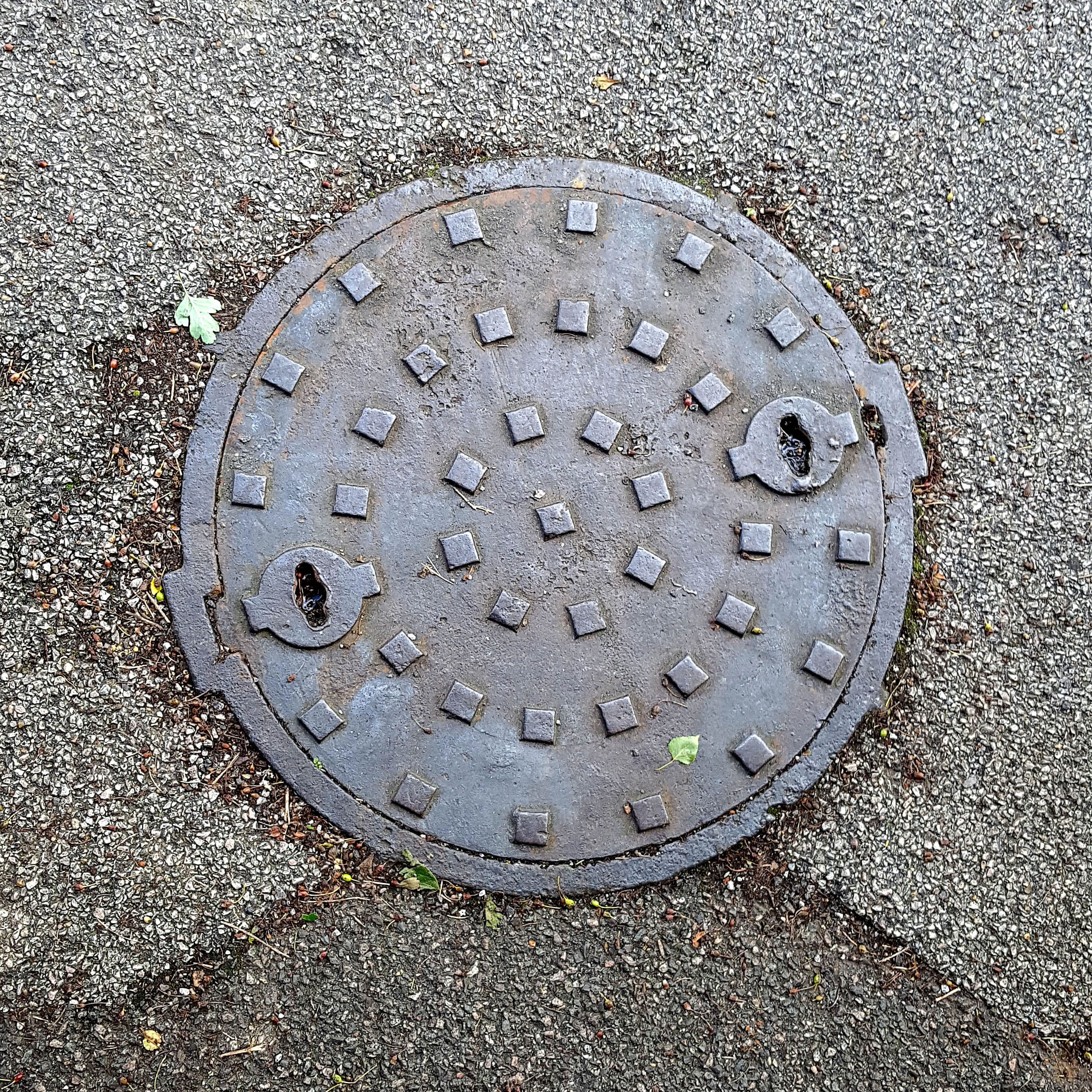 Manhole Cover, London - Cast iron with circular pattern of raised squares