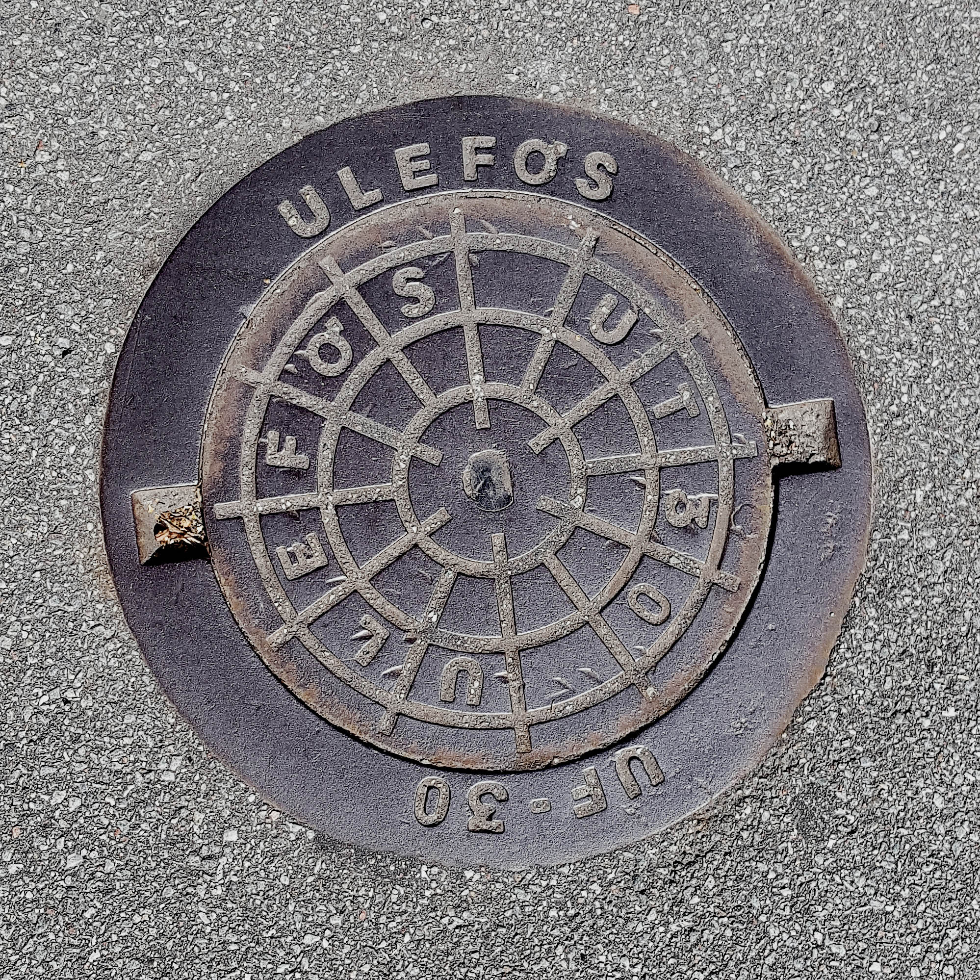 Manhole Cover, Frederiksvark Denmark - Cast iron surround inscribed with Ulefos UF-30 and inner circular grid pattern
