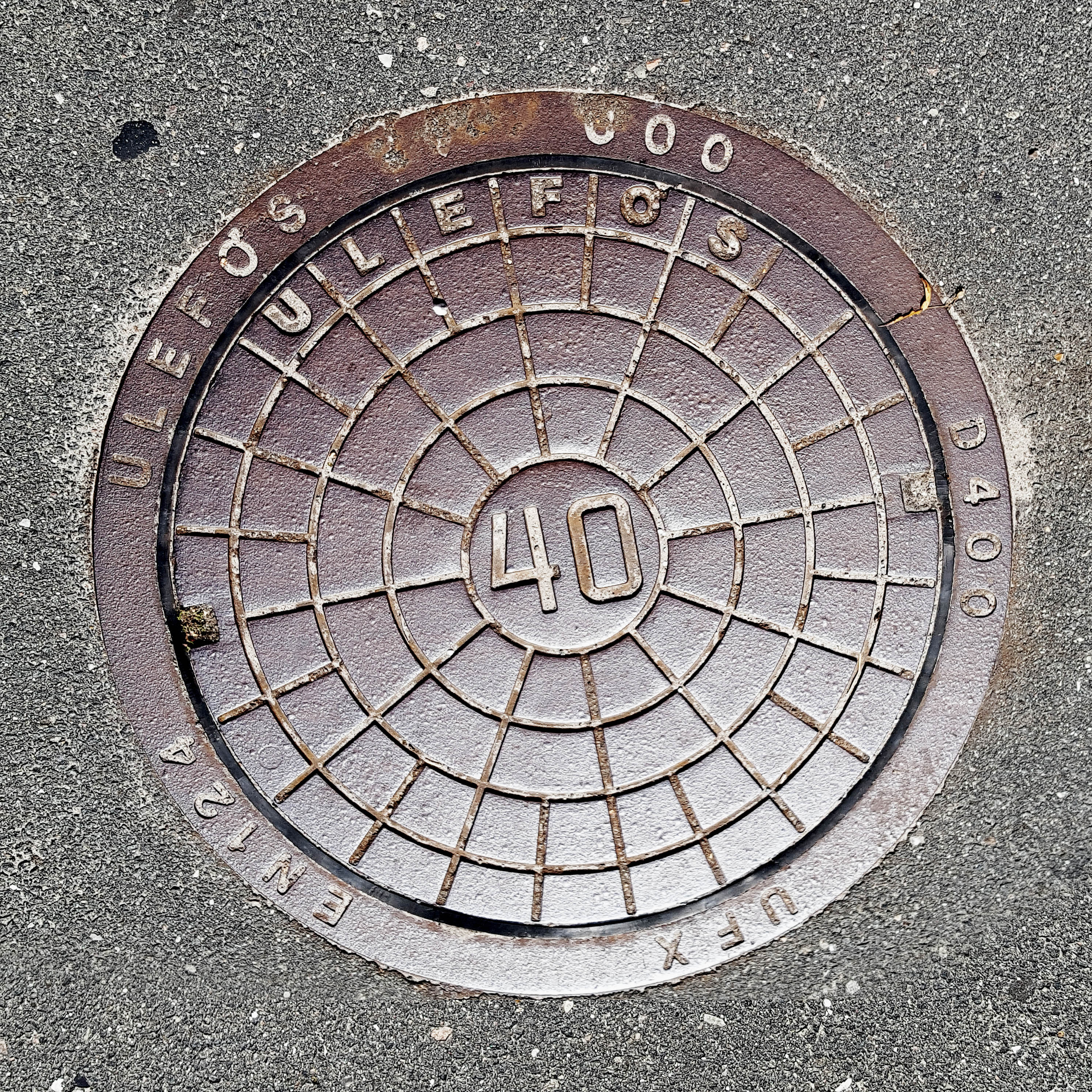 Manhole Cover, Frederiksvark Denmark - Cast iron surround inscribed with ULEFOS 000 0400 UFX EN124 - Inner, circular grid pattern