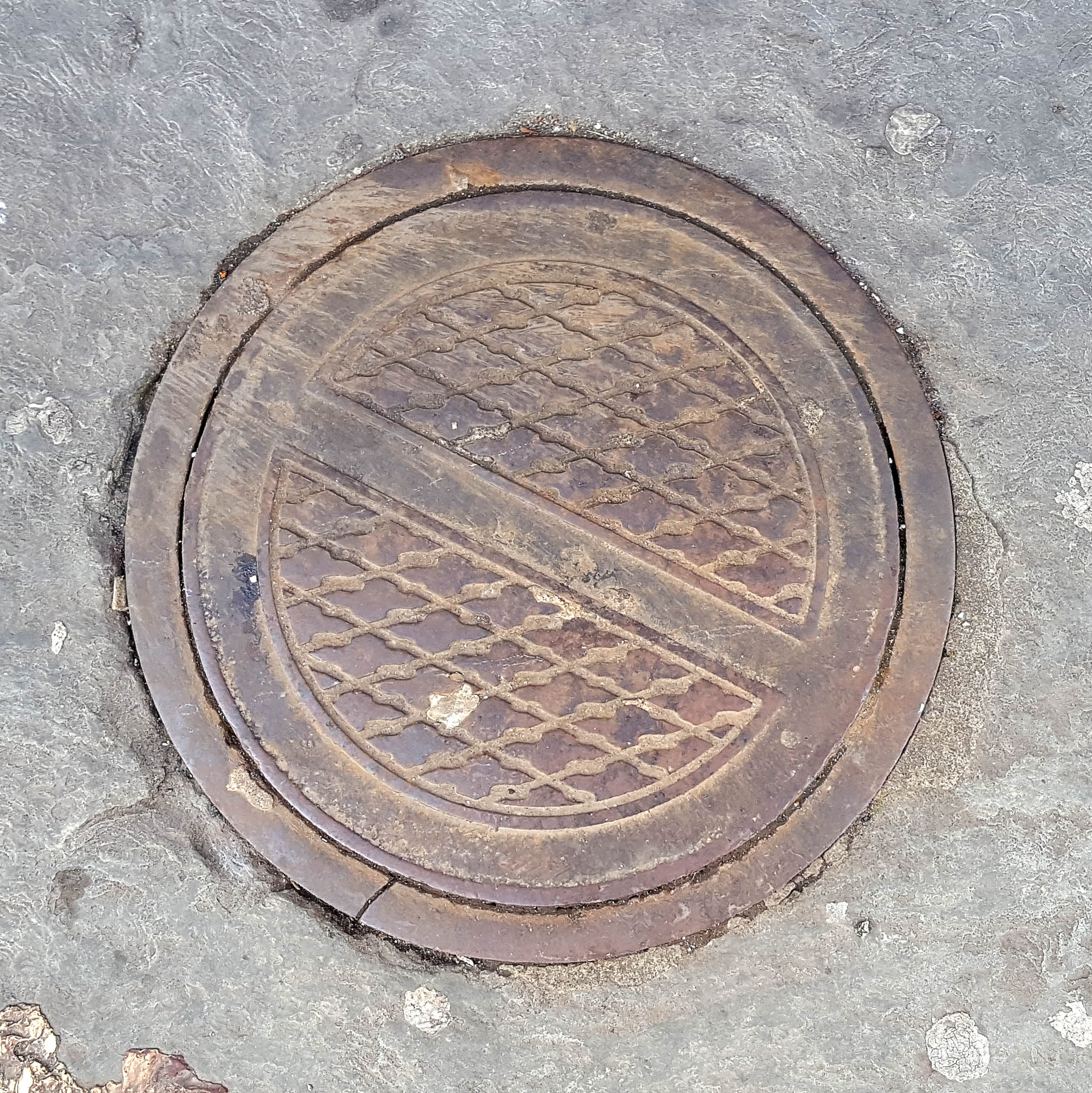 Manhole Cover, London - Cast iron with criss cross patterns