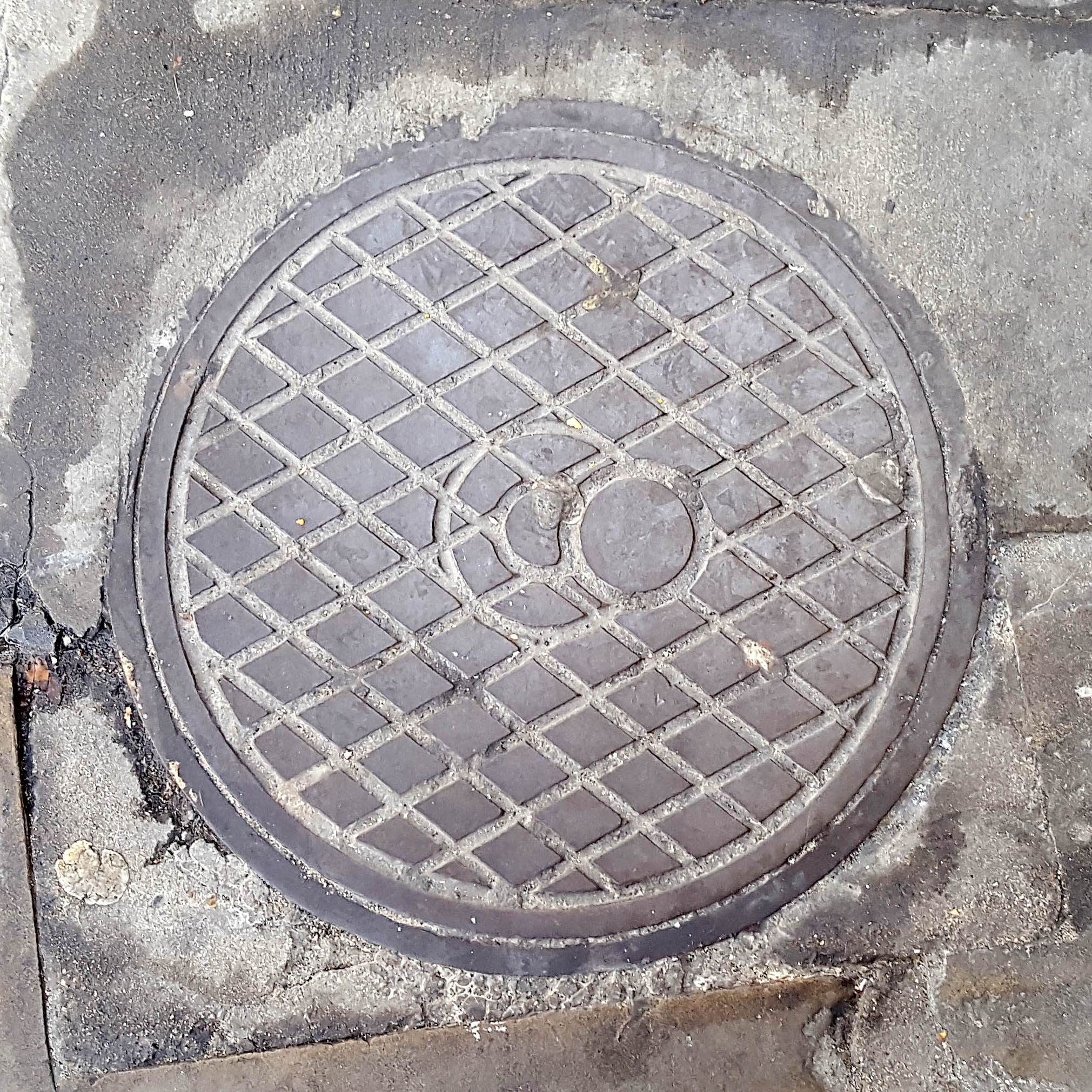 Manhole Cover, London - Cast iron with criss cross pattern