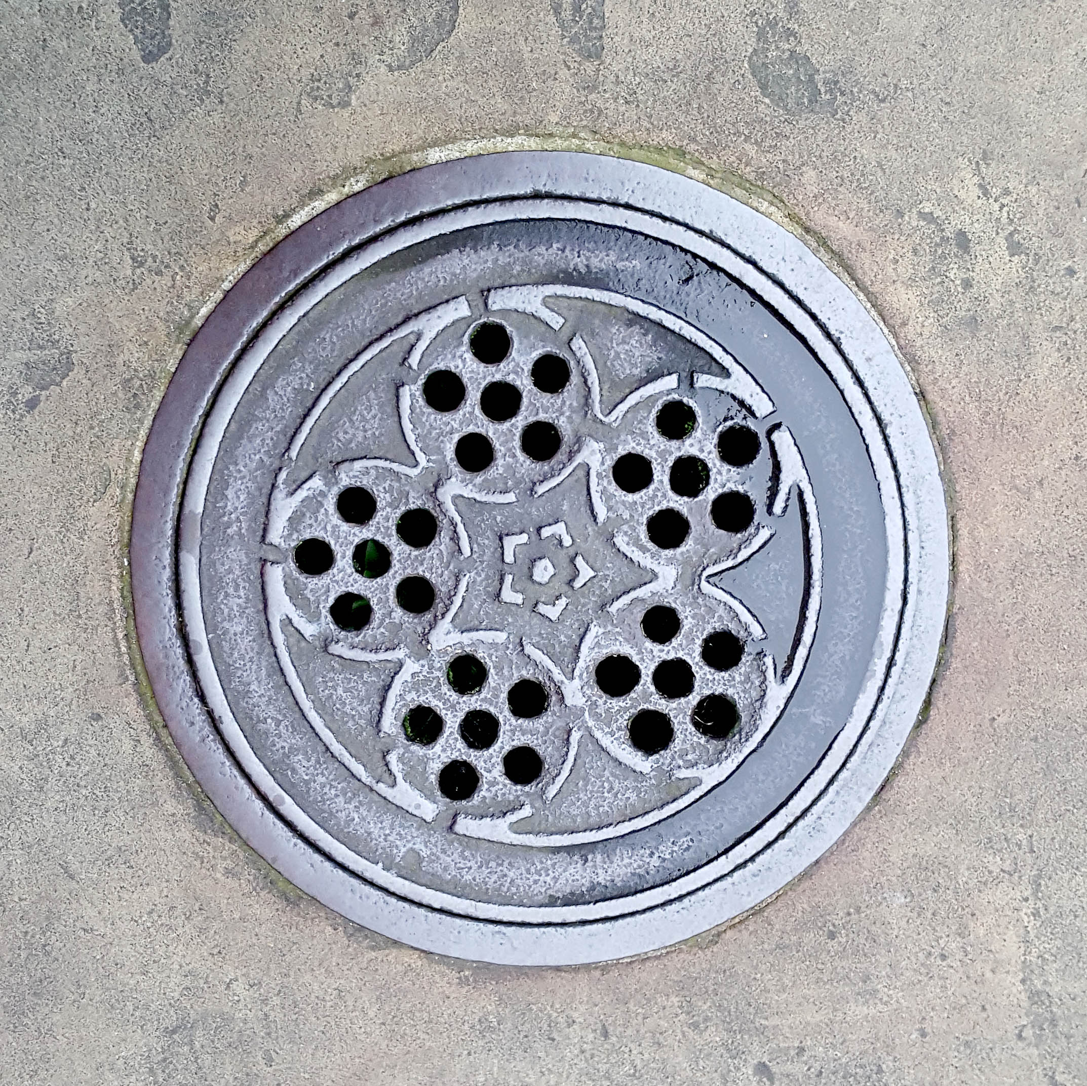 Manhole Cover, London - Cast iron with thirty holes arranged into five circular patterns