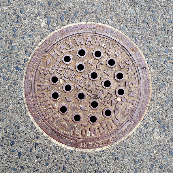 Manhole Cover, London - Cast iron, inscribed with Hayward's Patent, Borough London, Self Locking with a pattern of eighteen holes