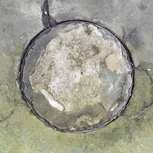 Manhole Cover, London - Cast iron rim with concrete centre