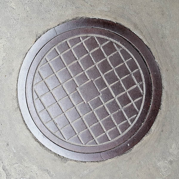 Manhole Cover, London - Cast iron grid pattern