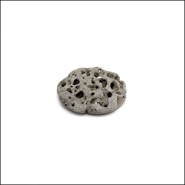Pebble - round, warm grey, pitted eroded