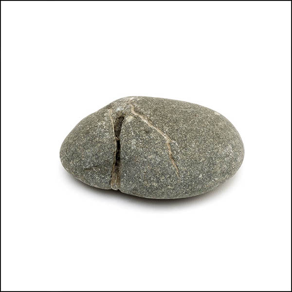 Pebble - uneven oval, warm grey, one eroded verticle line
