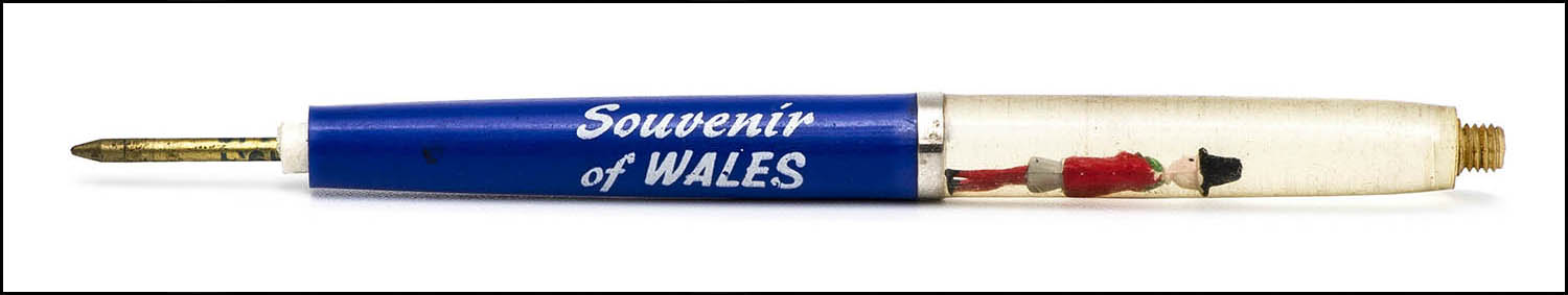 Floaty Souvenir Pen - Wales - floating man in traditional dress - royal blue with missing top and bottom