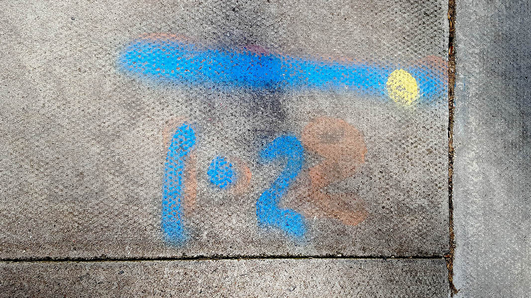 Pavement markings - spray painted squiggles on paving stones - Blue 1.2