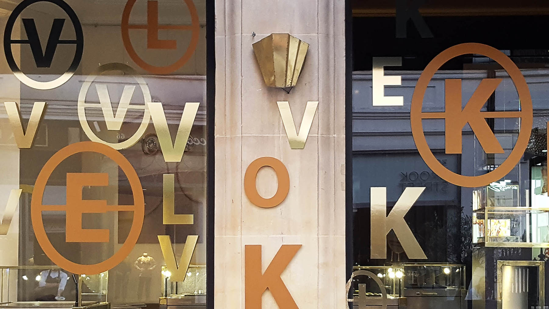 Annoushka Initials window display - gold and copper letters spelling Love